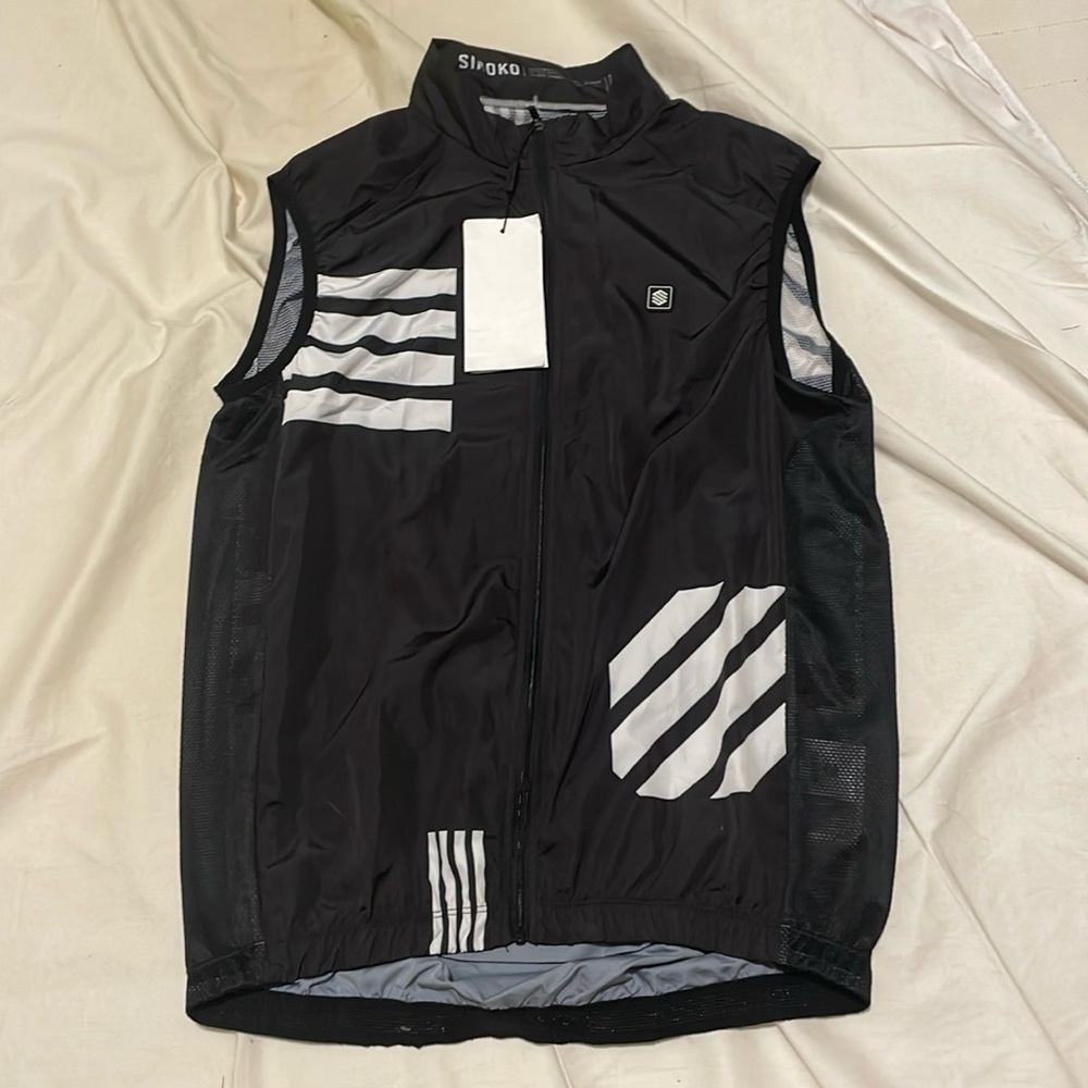 Siroko cycling vest size large. Water bottle pockets on back. Lightweight.